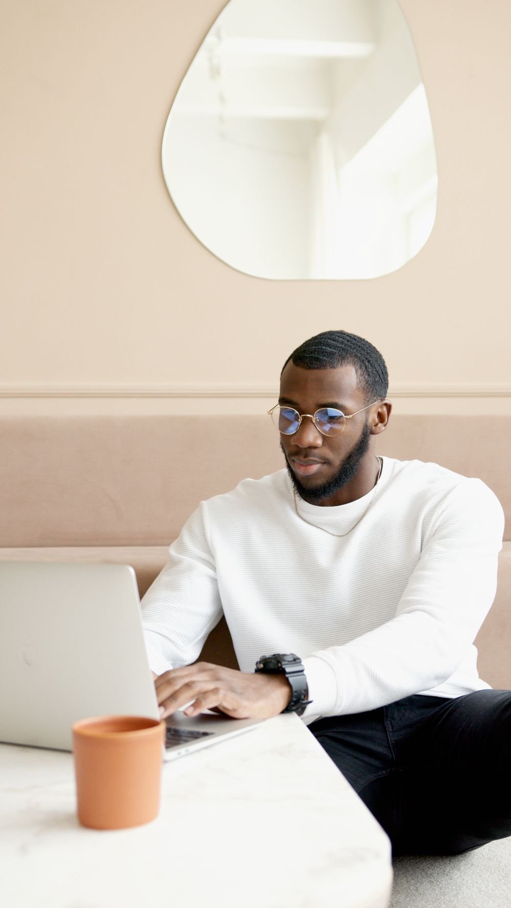 A professional reviewing work on a laptop